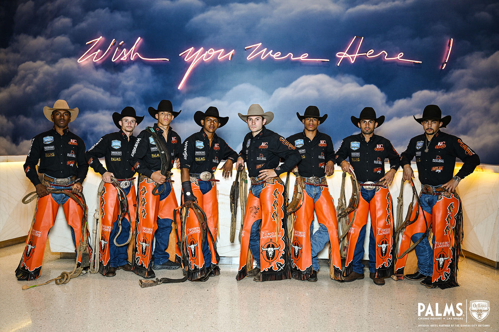 The Outlaws standing in front of a Wishing you were Here sign in Las Vegas at the PALMS Casino Resort!