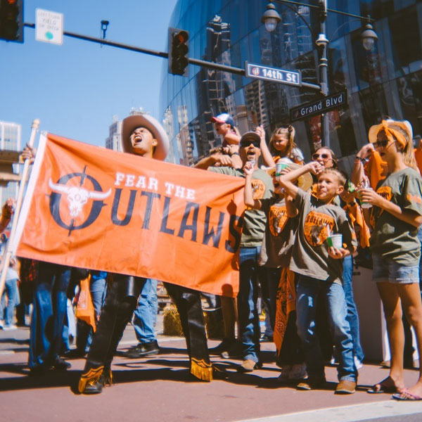 Fans in Outlaw Gear cheering with the Outlaws!